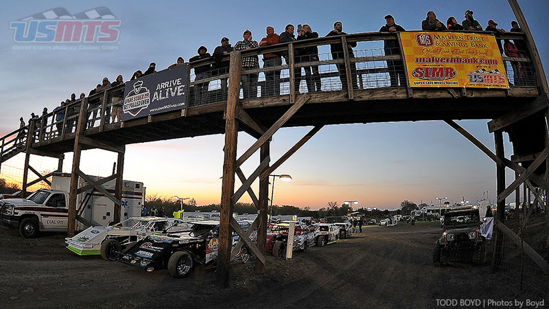 Pit crew members watch the heat races during the 9th Annual USMTS Missouri Meltdown at the I-35 Speedway in Winston, Mo., on Saturday, April 22, 2017.