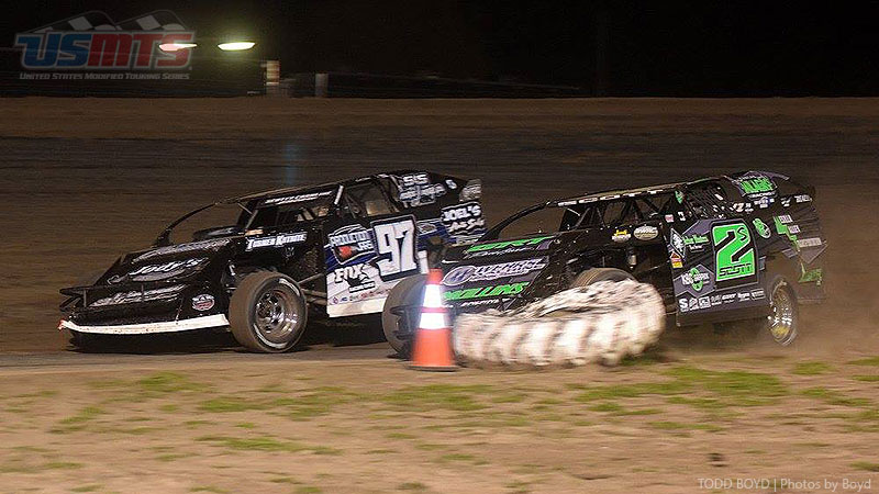 Stormy Scott (2s) runs out of room trying to pass Cade Dillard (97) for the lead during the 9th Annual USMTS Missouri Meltdown at the I-35 Speedway in Winston, Mo., on Saturday, April 22, 2017.