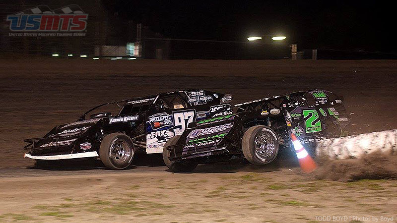 Stormy Scott (2s) runs out of room trying to pass Cade Dillard (97) for the lead during the 9th Annual USMTS Missouri Meltdown at the I-35 Speedway in Winston, Mo., on Saturday, April 22, 2017.
