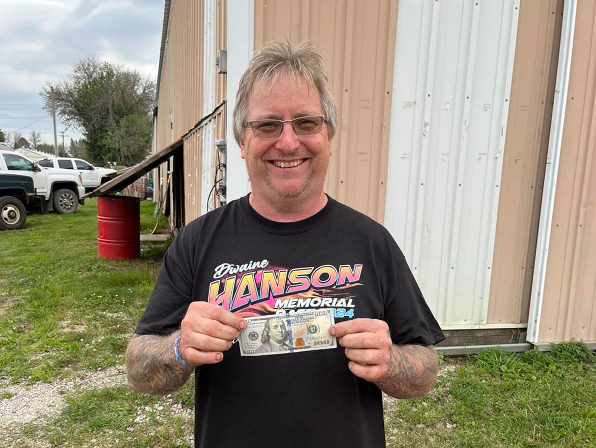 Darwyn Karau collects an extra $100 for his entry fee courtesy of Hyperco on Night #1 of the Hall of Fame Race at the Mason City Motor Speedway.