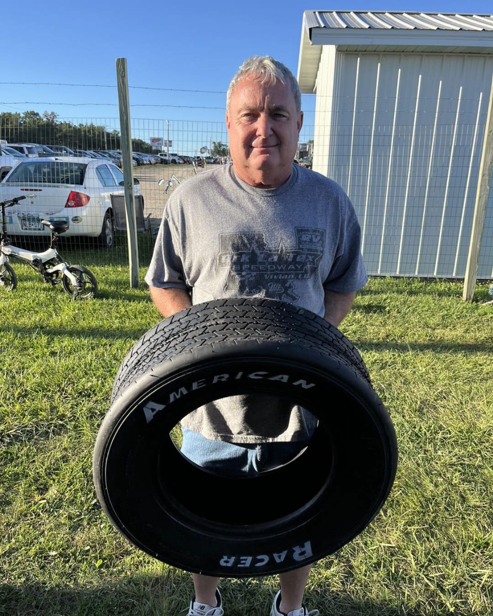 Kenny Gaddis collects an extra tire at the drivers meeting courtesy of American Racer Tires on Night #1 of the Fall Jamboree at the Deer Creek Speedway.